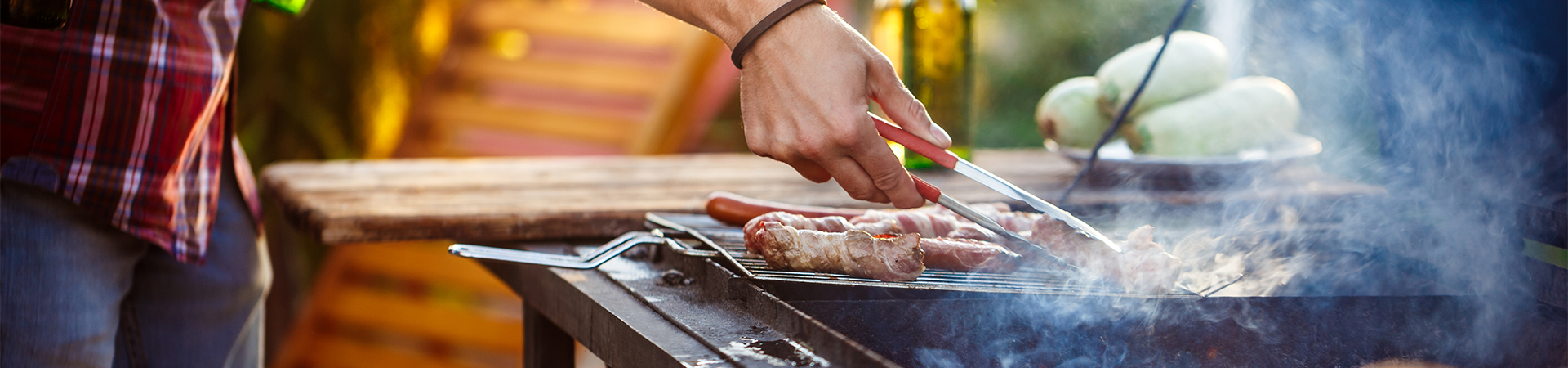 young-men-roasting-barbecue-grill-cottage-countryside